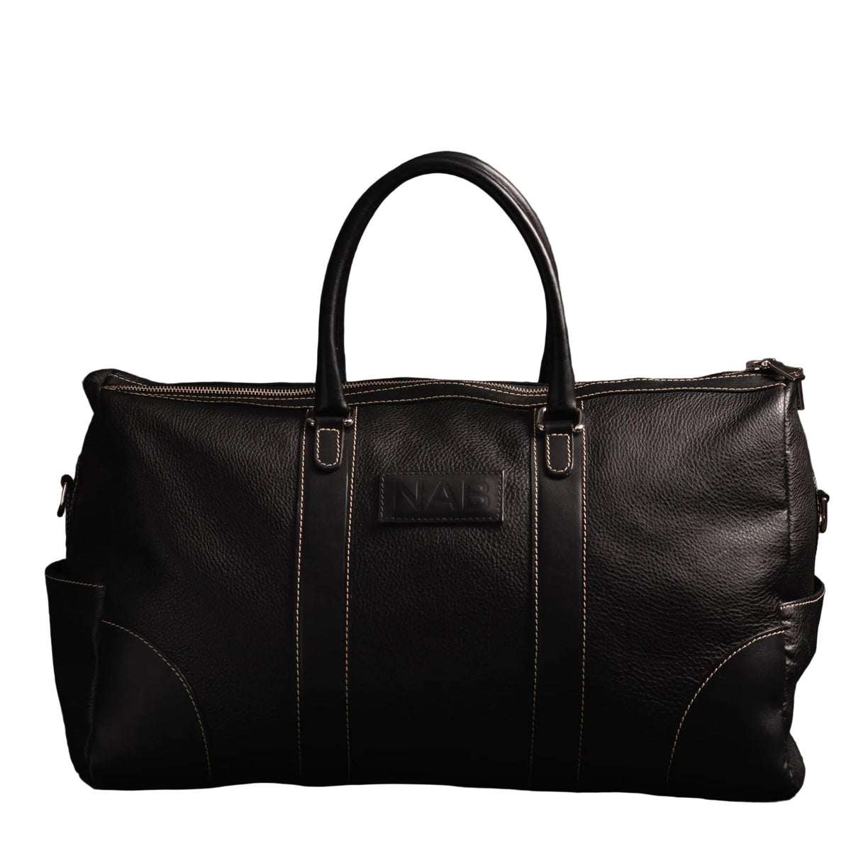 "The Shield Duffle in black — handcrafted full-grain leather duffle bag with rolled leather handles, YKK zipper, and side pockets, made in Canada by NAB Leather"