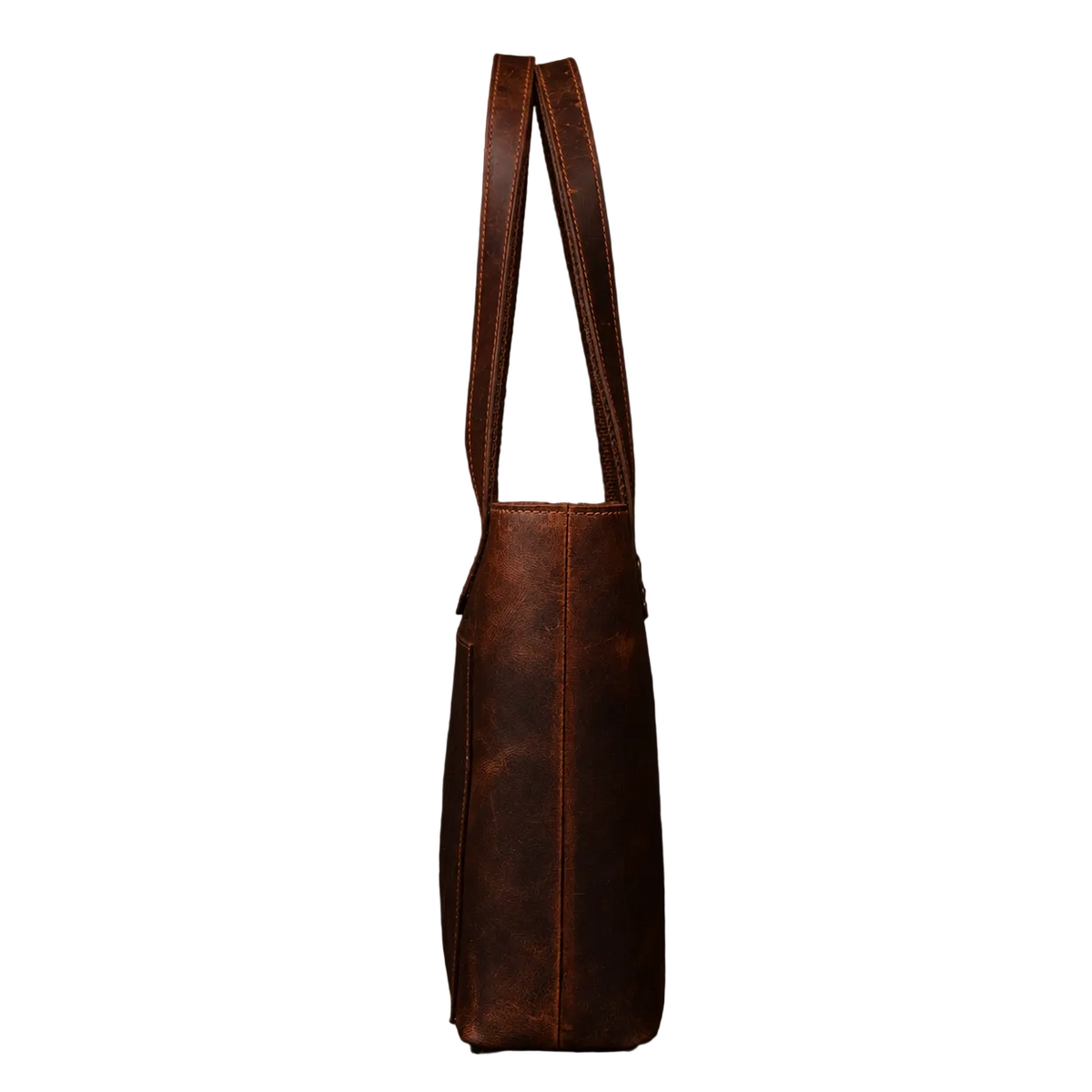 "Side profile of the Classic Brown Leather Tote Bag showing depth and long rolled leather handles — handcrafted in Canada by NAB Leather"