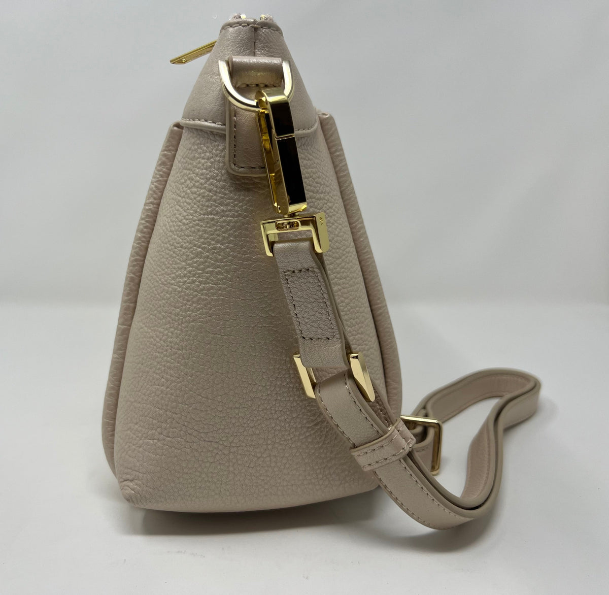 Side view of Elena champagne leather crossbody bag — Annick Levesque