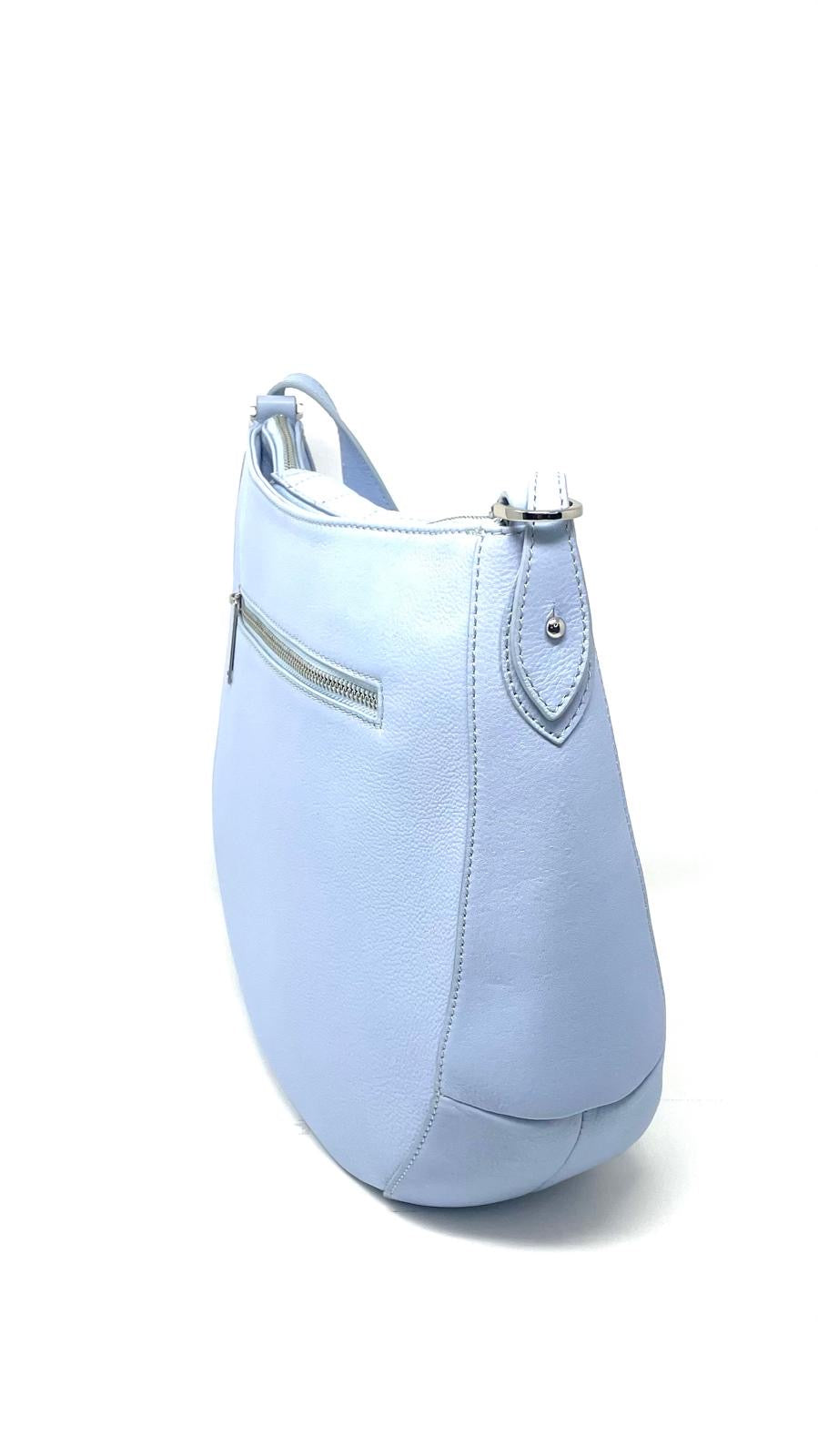 Side view of Isabelle pale blue leather 2-in-1 handbag with shoulder strap — Annick Levesque