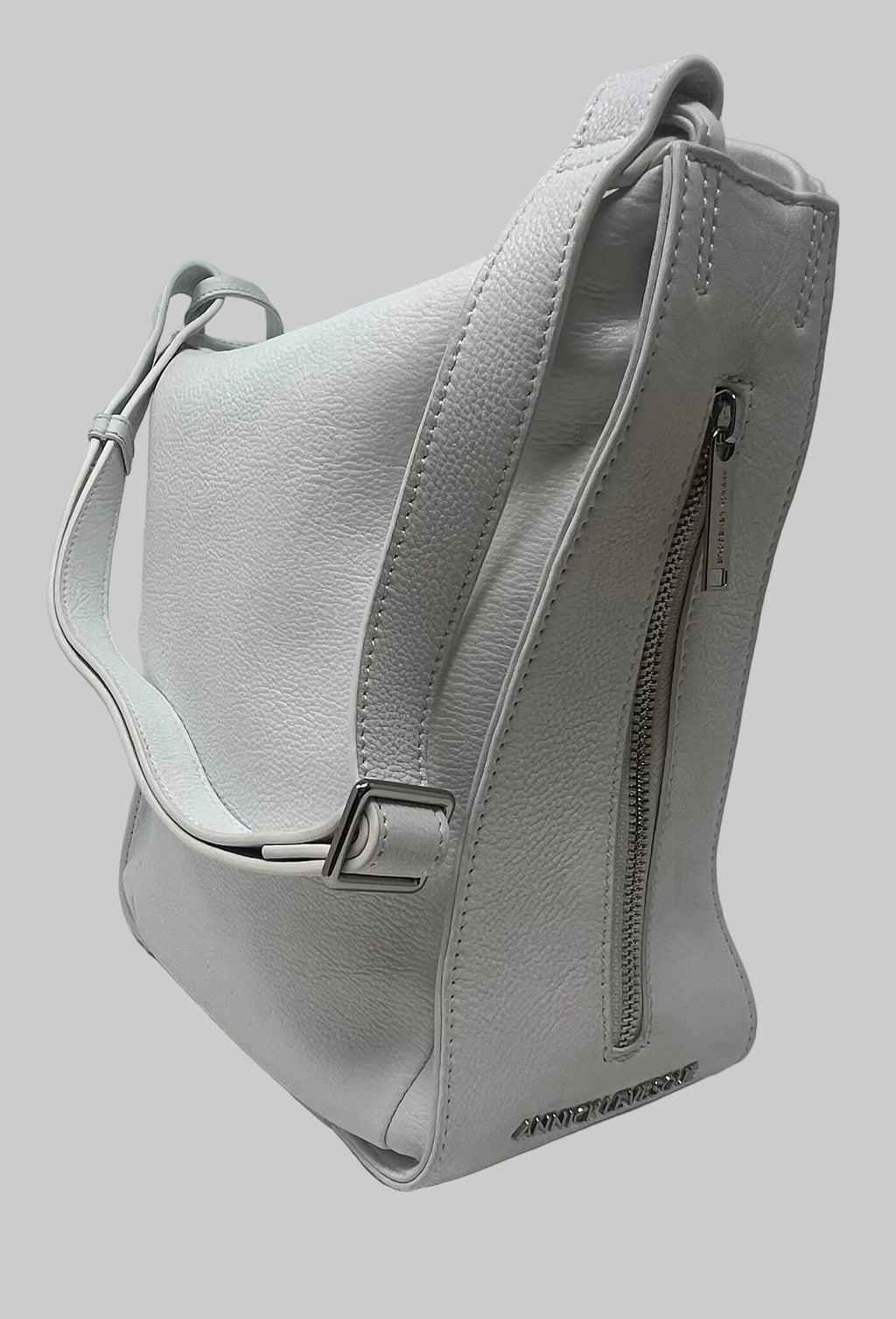"Back view of the Julie Soft Crossbody Hobo Bag in white showing rear zippered pocket and adjustable strap hardware — Annick Levesque"