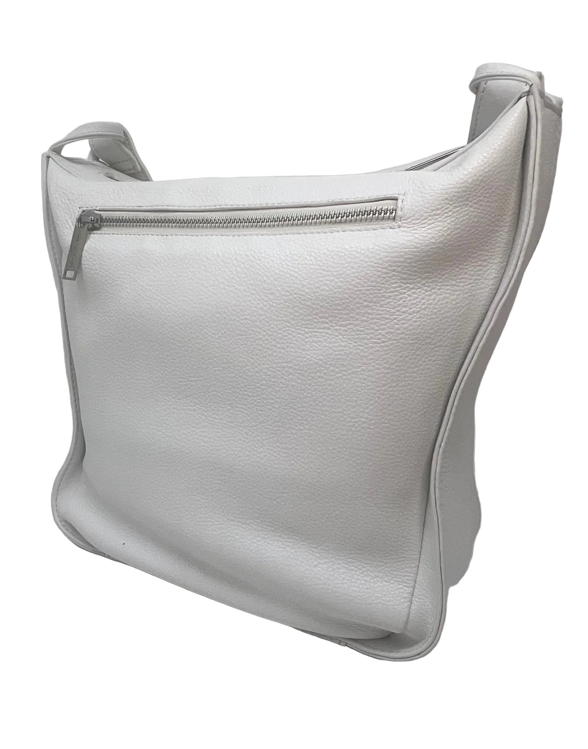 "Side view of the Julie Soft Crossbody Hobo Bag in white showing side water bottle pocket — full-grain leather crossbody by Annick Levesque"