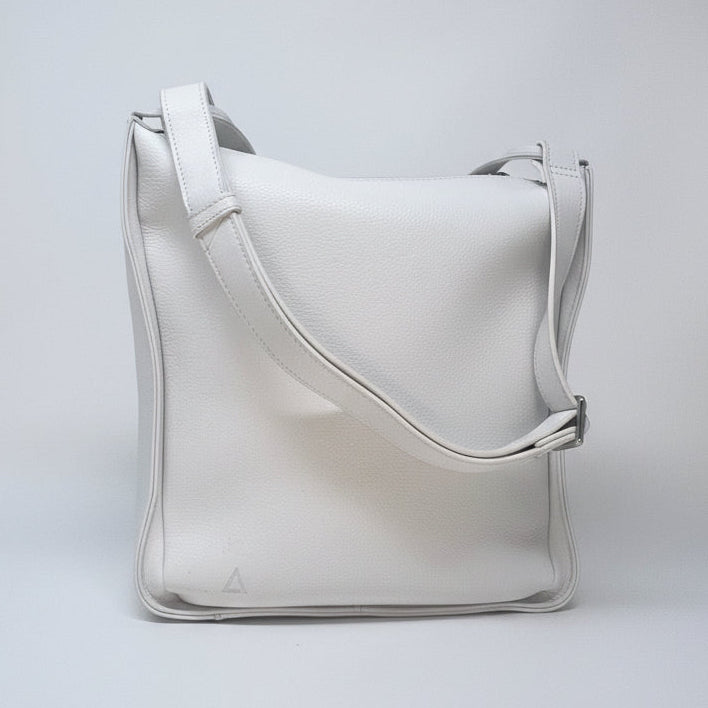 "Julie Soft Crossbody Hobo Bag in white full-grain aniline leather with adjustable shoulder strap — designed in Montreal by Annick Levesque"