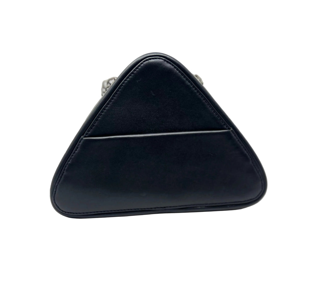 Back view of the Kiana triangular black leather evening bag, showing the integrated exterior phone pocket with subtle silver chain links peeking over the top.