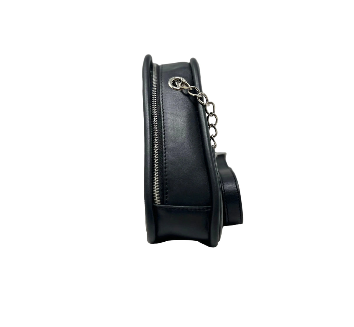 Side profile view of the Kiana triangular black leather evening bag, showing its depth, a matching silver zipper tracks, and silver chain hardware attachments against a crisp white background.