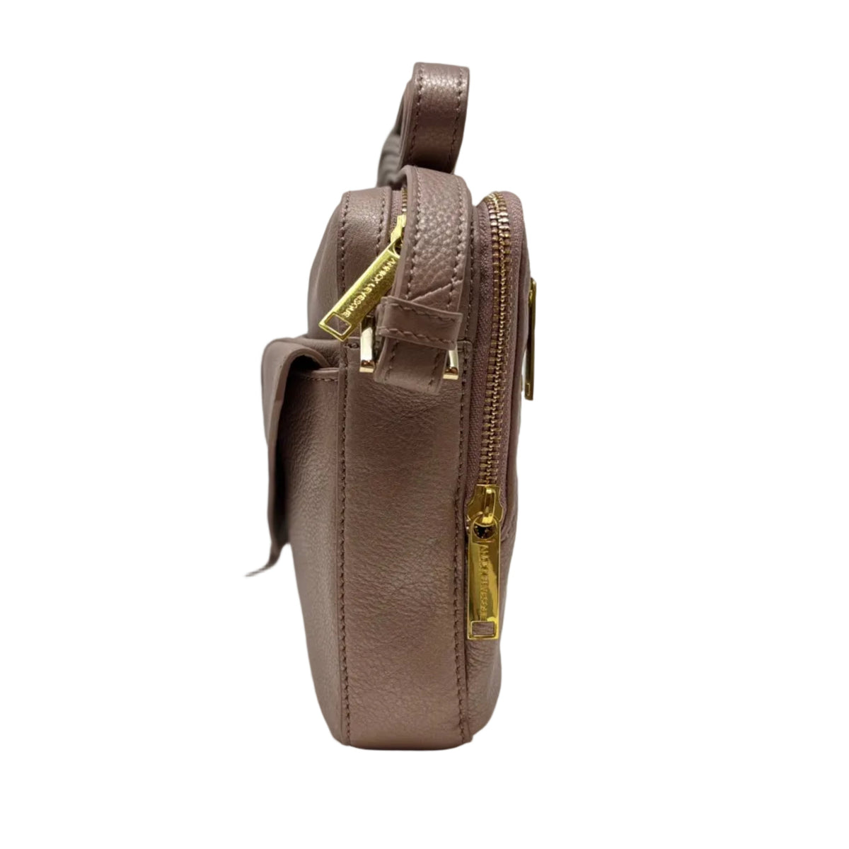 Side view of Nadine platinum rose leather crossbody bag showing zip pocket — Annick Levesque