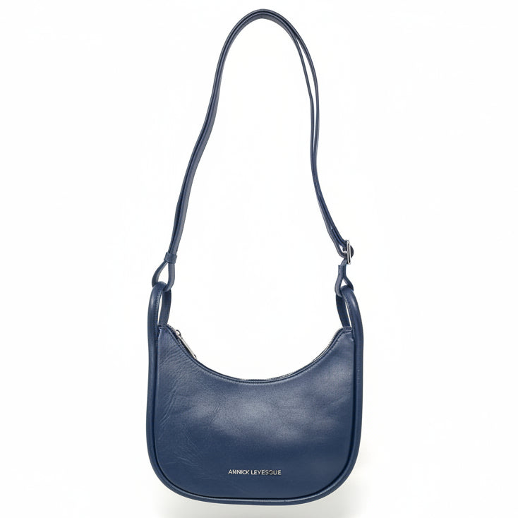 Annick Levesque Sabrina navy blue genuine leather crossbody bag with adjustable shoulder strap.