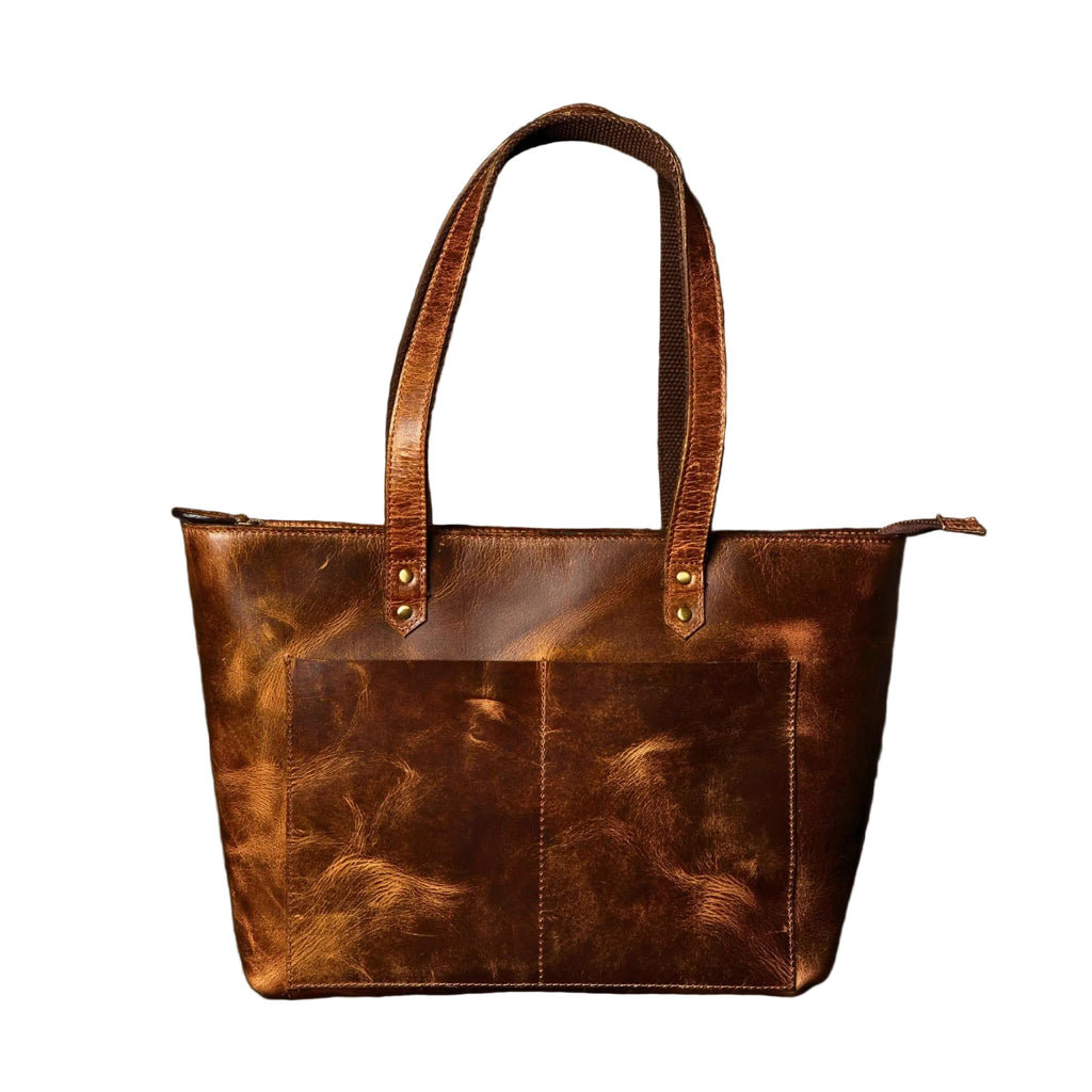 "Classic Brown Leather Tote Bag front view showing distressed full-grain leather texture and exterior pockets — handcrafted in Canada by NAB Leather"