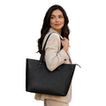 "Woman carrying the Classic Black Leather Tote Bag over her shoulder — full-grain leather handbag by NAB Leather"