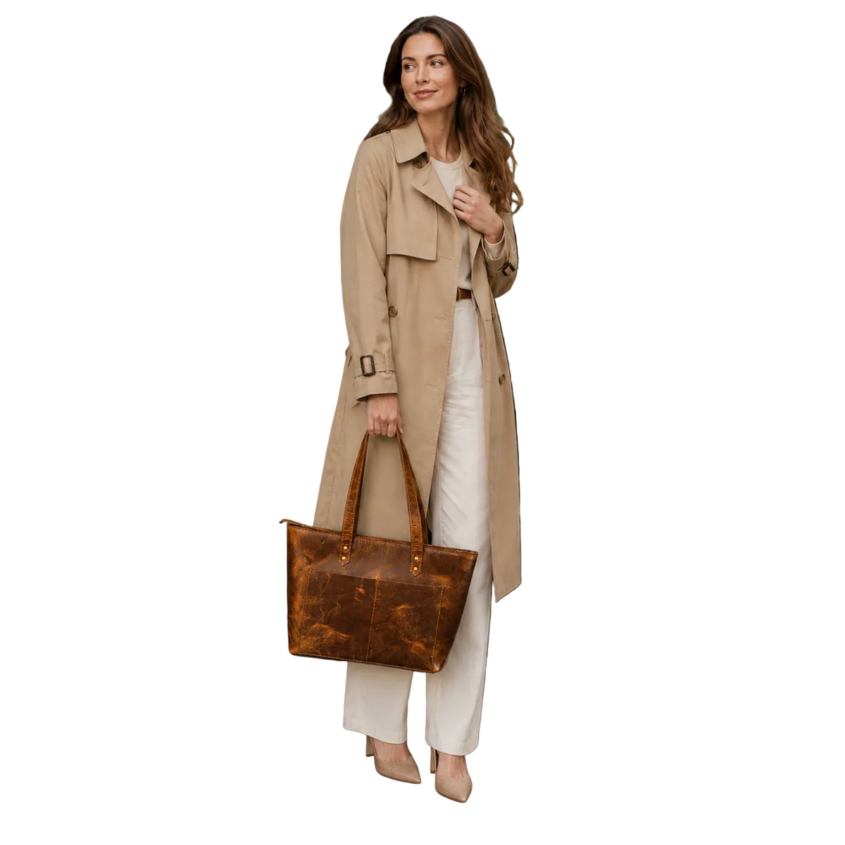 "Woman in a tan trench coat carrying the Classic Brown Leather Tote Bag — versatile full-grain leather handbag by NAB Leather"