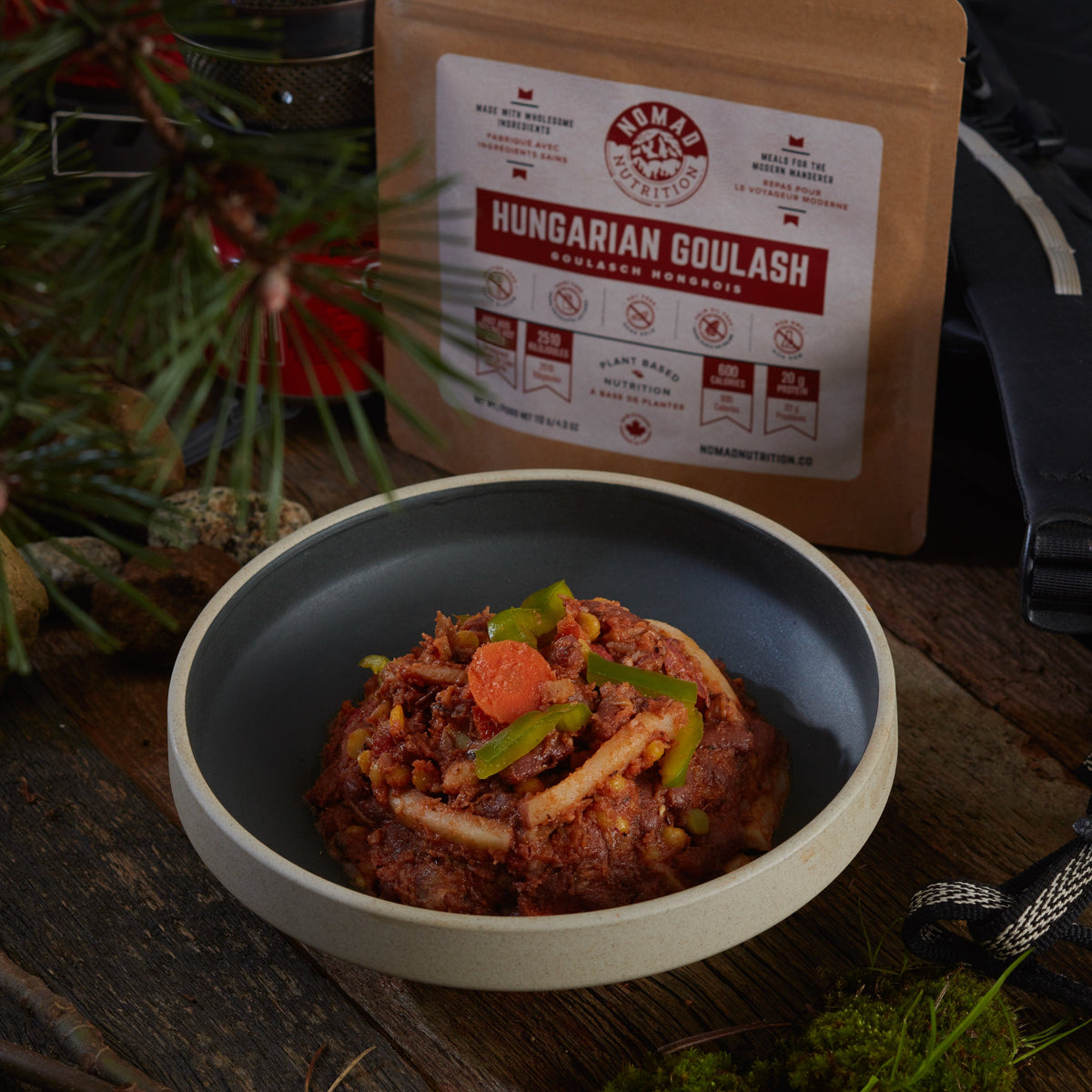 Bowl of Hungarian goulash with a package labeled 'Hungarian Goulash' in the background.