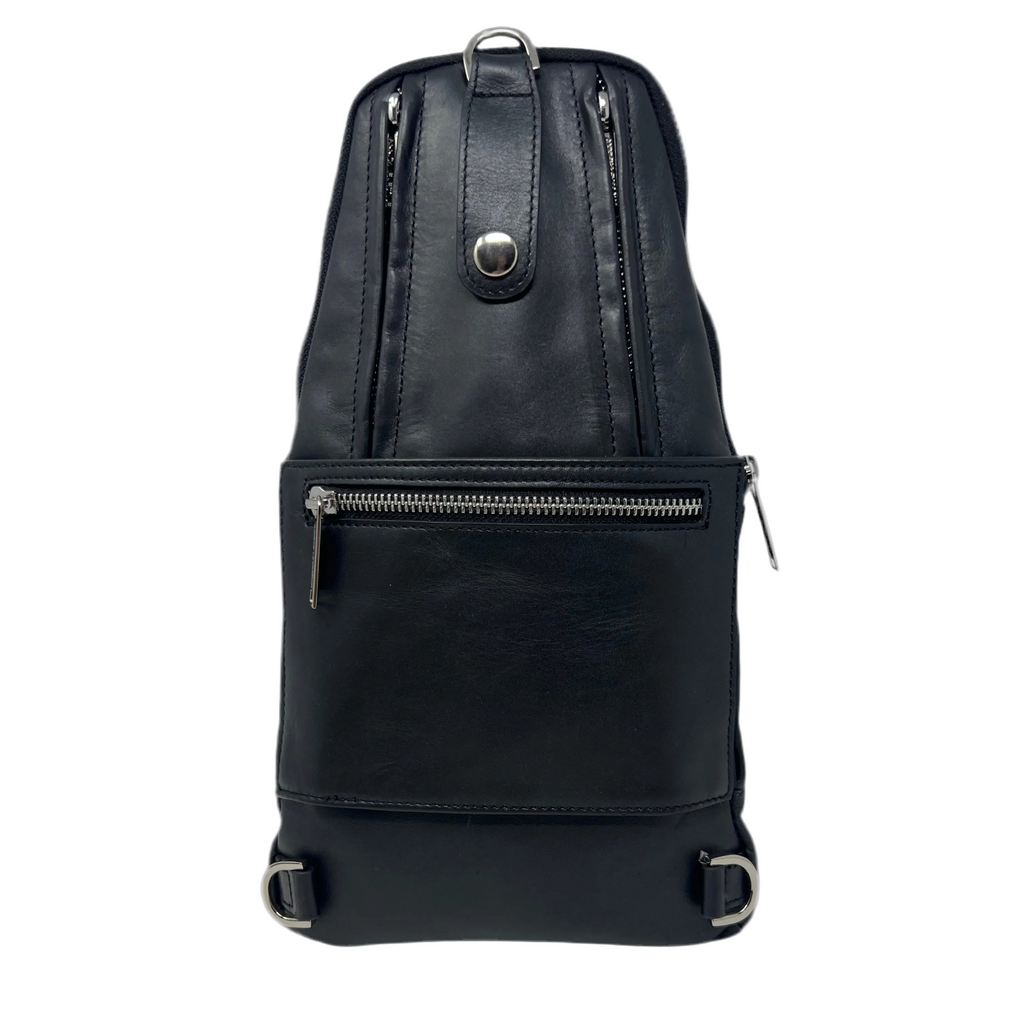 Back view of the Gabriel 3-in-1 unisex black crossbody travel bag, highlighting a silver-zippered passport pocket, a snap-button luggage strap panel, and metal D-rings for multi-way backpack strap attachment.