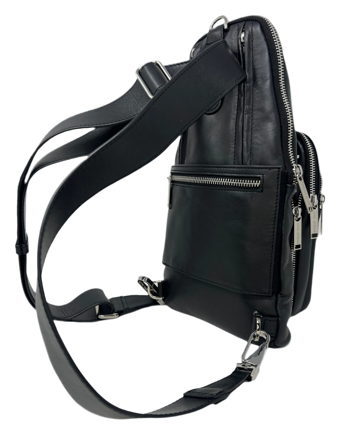 Three-quarter rear view of the Gabriel 3-in-1 unisex black travel bag configured with its wide, adjustable black leather shoulder straps clipped into the lower metal D-rings.