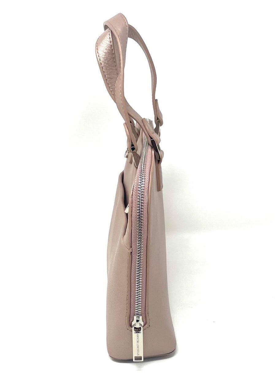 Side profile of Justine platinum rose genuine leather handbag — Annick Levesque